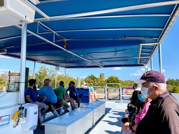 image shows a pontoon boat tour in Everglades National Park, the starting point for a two day tour to Everglades National Park