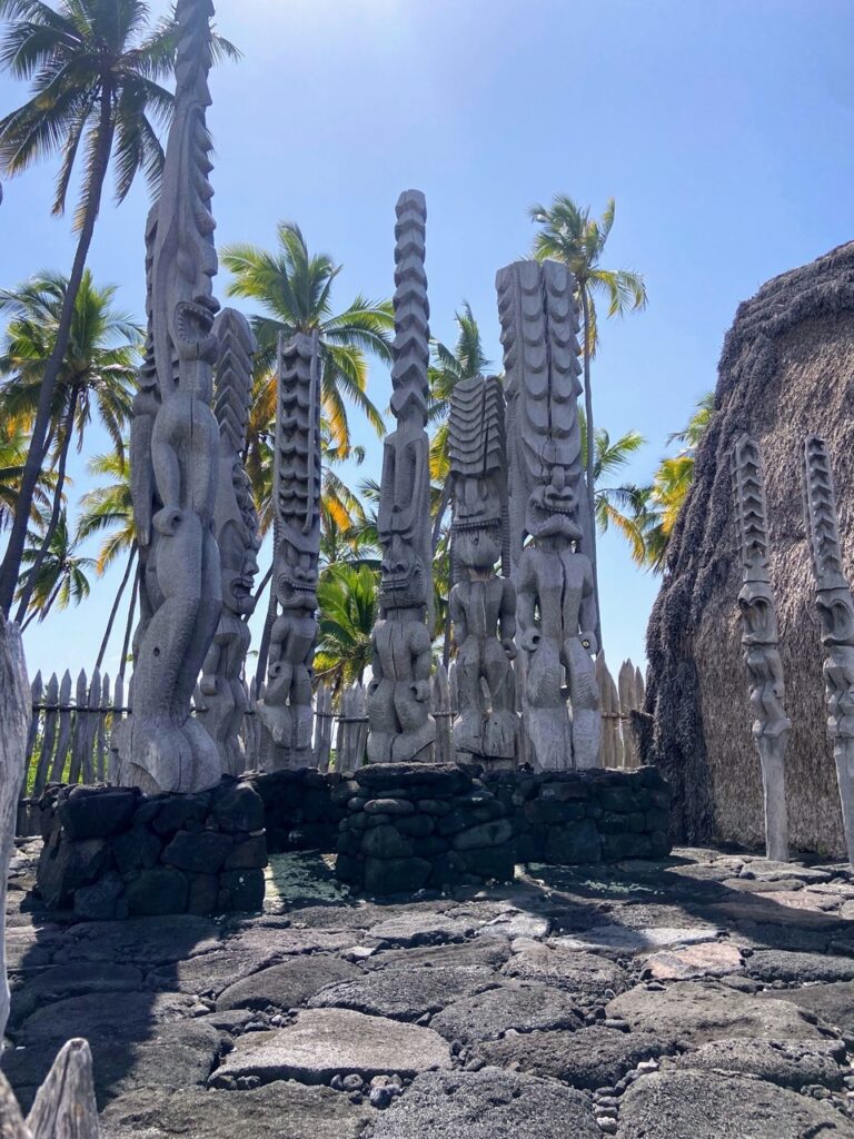 image shows wooden carvings at Puʻuhonua o Hōnaunau, part of a five day itinerary focused on national parks on the Big Island of Hawaii