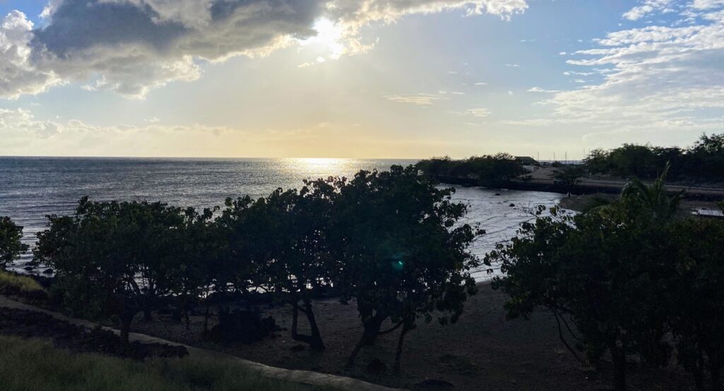 image shows the bay from a viewpoint at Puʻukoholā Heiau