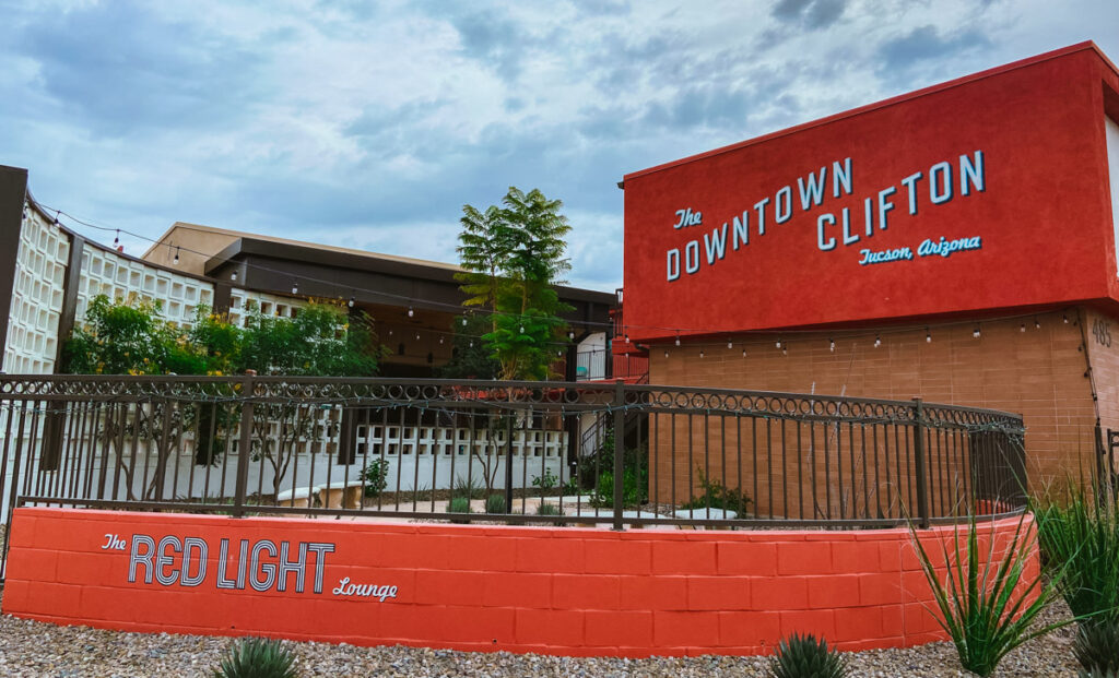 image shows the outside of a hotel in tucson with red brick