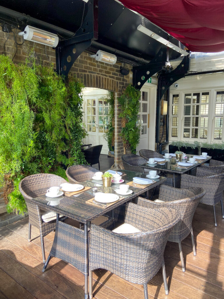 image shows a charming patio at the Montague hotel