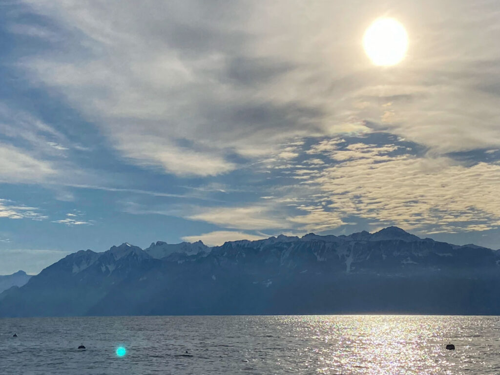 the alps and lake geneva on a recent visit. the sun is not as bright in the overhead sky because of the shortened winter days in lausanne